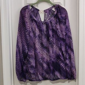 Jennifer Lopez purple blouse with gold neck accent